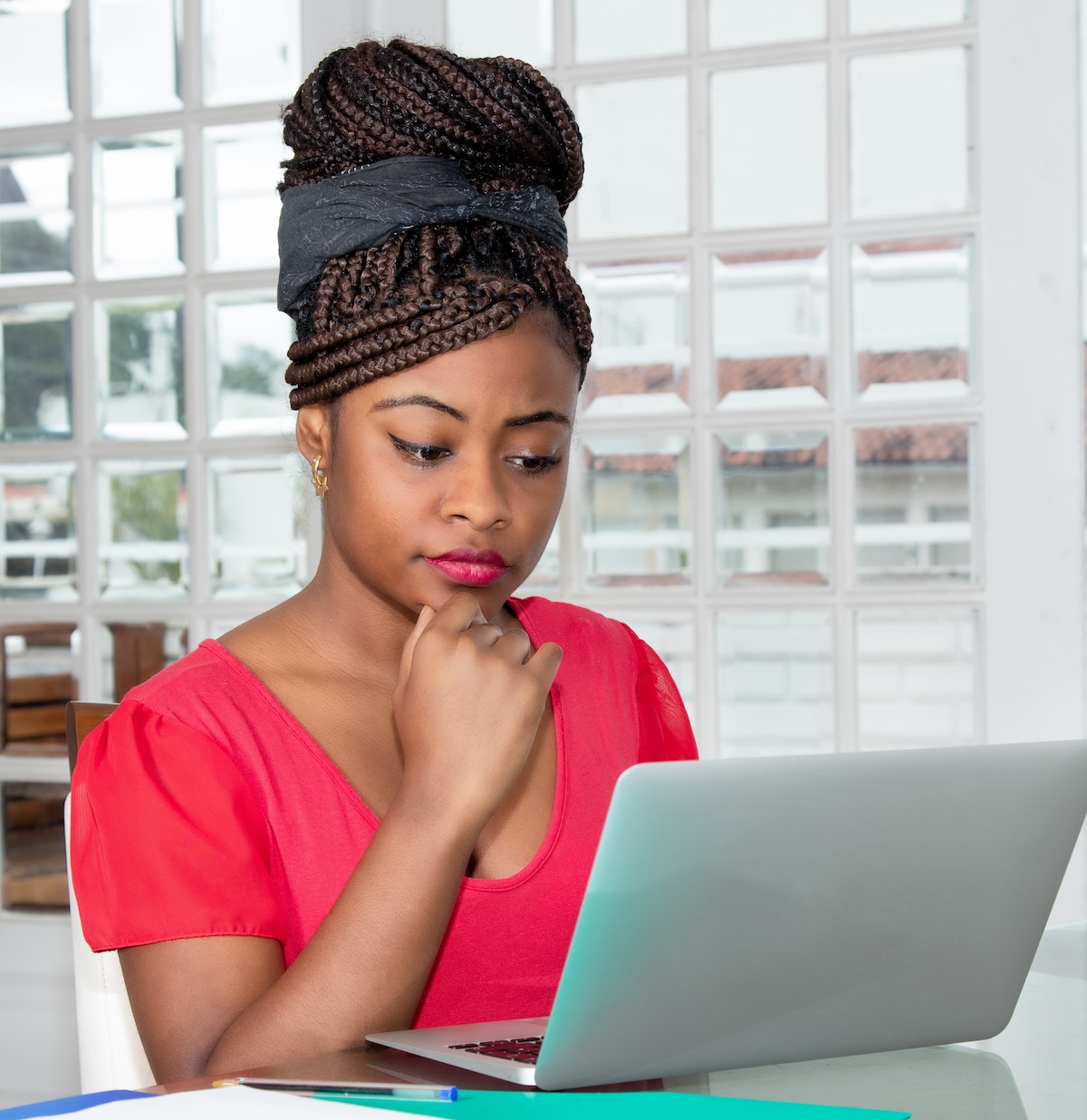 woman looking at a laptop and testing for website security